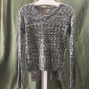 Black/White Sweater with slit half way up. Size M
